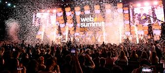 Web Summit 2024 logo with dates November 11-14, 2024, held in Lisbon, Portugal.- Instasav.in, Attendees at Web Summit checking in at the registration desk, showcasing vibrant event atmosphere.- Instasav.in, Tech industry leaders engaging in a panel discussion at Web Summit, highlighting networking opportunities.- Instasav.in, Exterior view of Altis Grand Hotel, a recommended nearby accommodation for Web Summit attendees.- Instasav.in, Altice Arena and FIL, the venues for Web Summit 2024, located in Lisbon. - Instasav.in